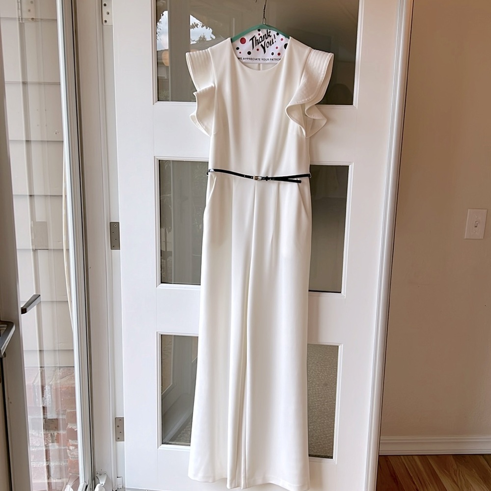 Ultimate elegance. Soft white stitched cap/flutter sleeves Calvin Klein jumpsuit